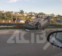 Черный седан перевернулся в на выезде из Корсакова