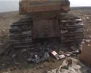Более 1000  дисков раздавил бульдозер в Южно-Сахалинске, Фото: 1